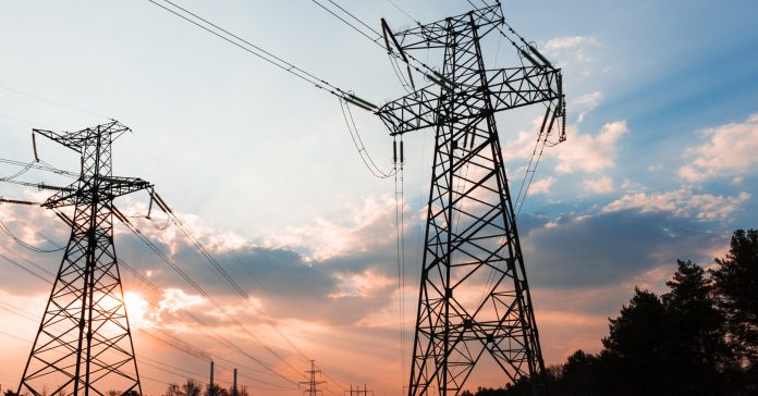 High-voltage power lines. Electricity distribution station. high voltage electric transmission tower. Distribution electric substation with power lines and transformers.