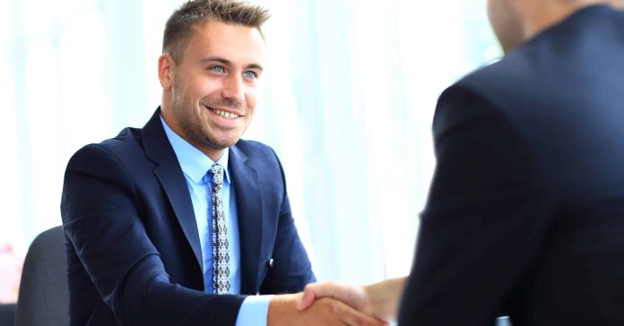 Business people shaking hands, finishing up a meeting